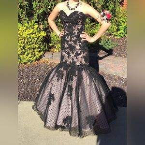 Black lace prom dress with pink underlay.